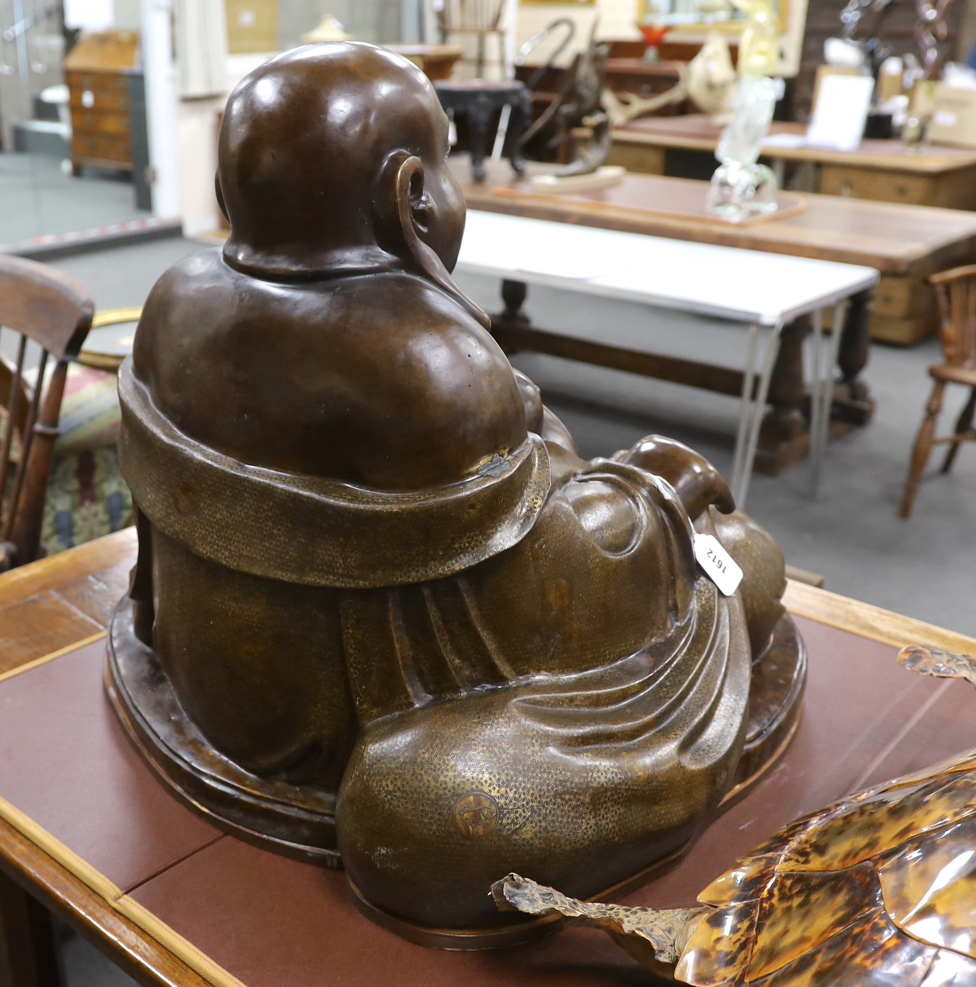 A massive Chinese bronze seated figure of Budai, 62cm high